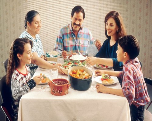 Calm family dinner at home with traditional elements