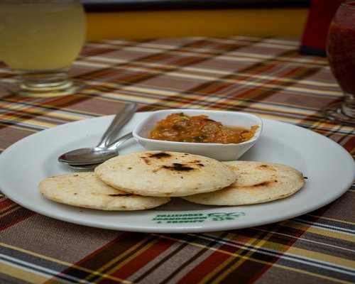 Home breakfast in Colombia with arepas and coffee